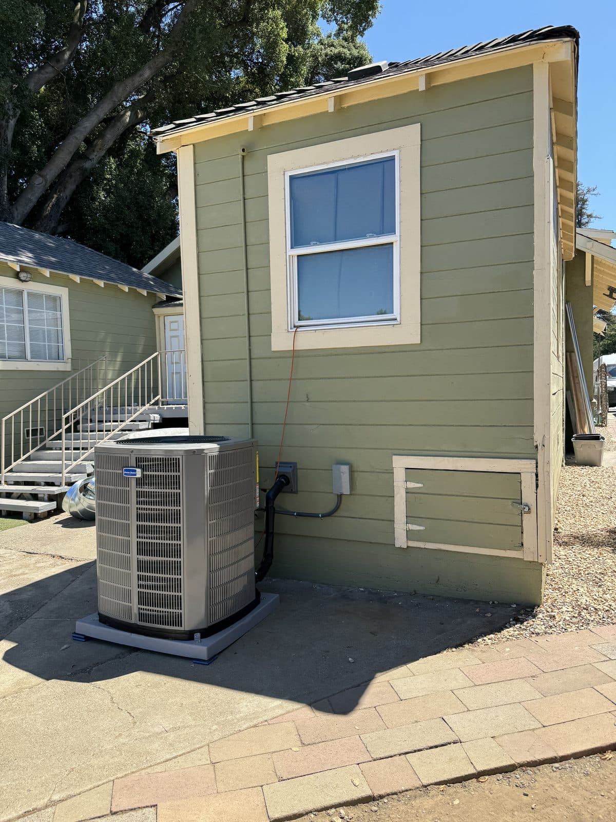 New AC condenser installed at a Sacramento house exterior