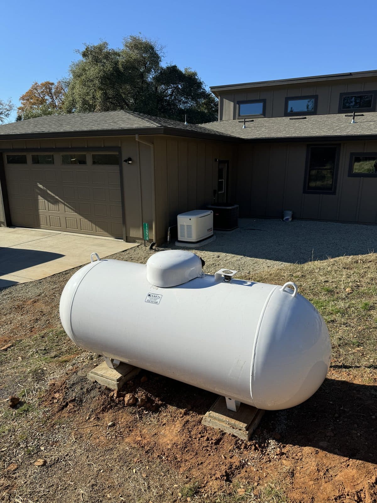 Generac whole-home standby generator installed with propane tank at Sacramento residence