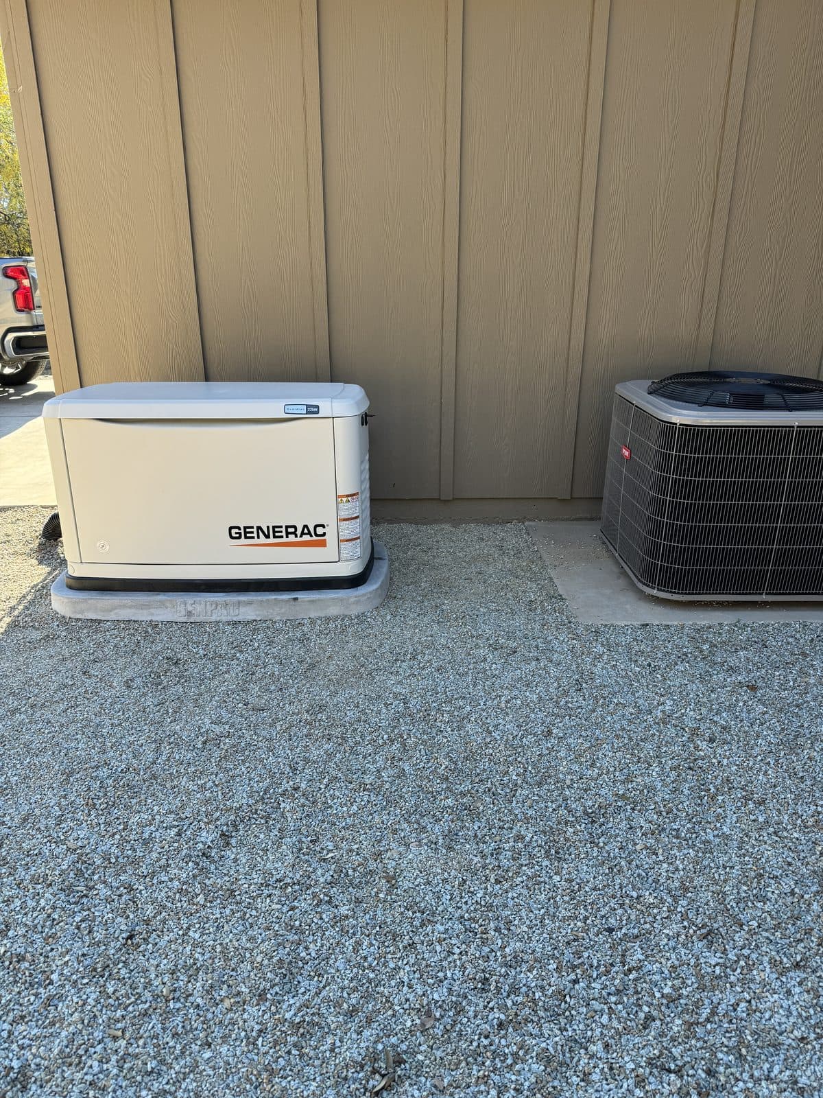 Generac generator installed alongside AC condenser unit
