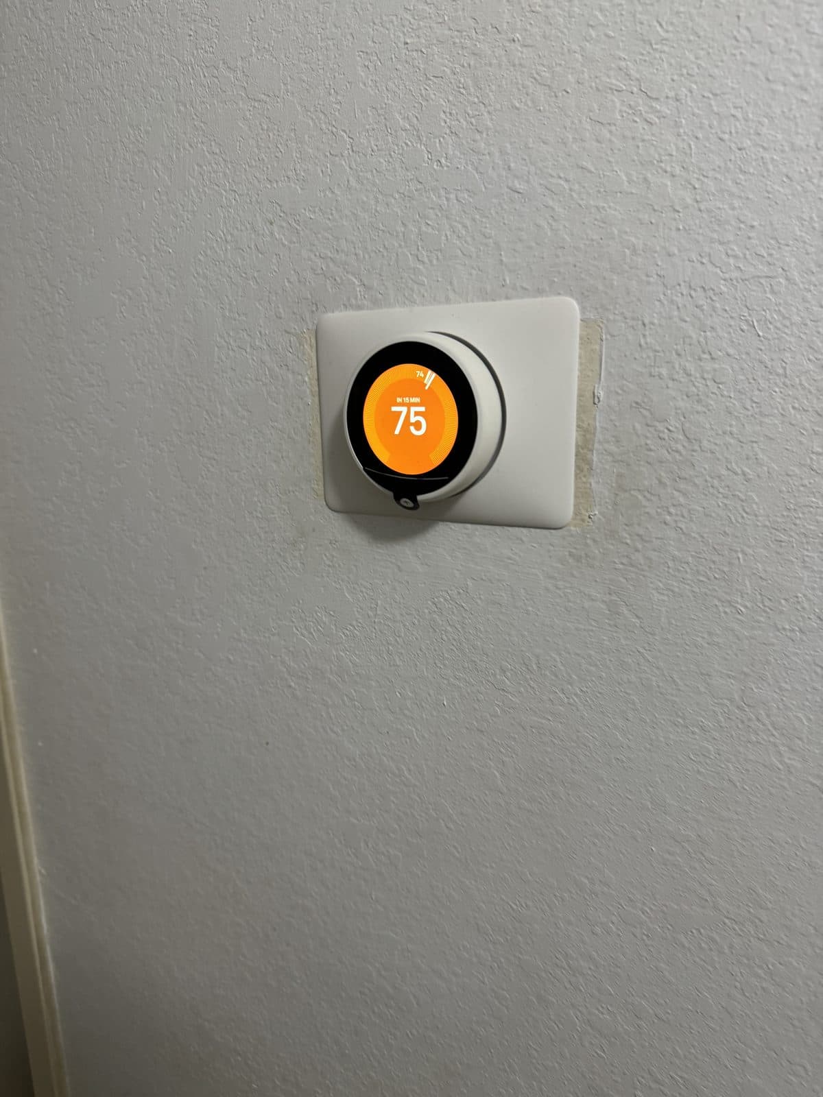 Nest smart thermostat installed and set for heating